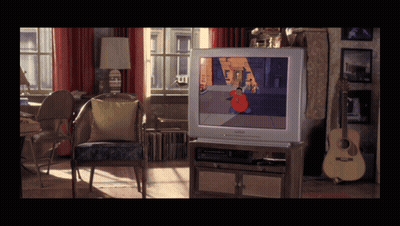 A Living Room With A Philips Tv On The Entertainment Center GIF