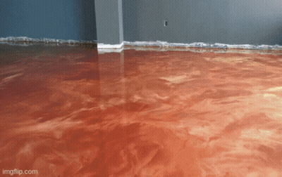 A Living Room With Blue Floors And A Couch And Chair GIF