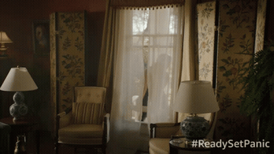 A Living Room With Chairs And Lamps And The Words #Readysetpanic On The Bottom GIF