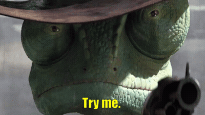 A Lizard Wearing A Cowboy Hat And Pointing A Gun With The Words Try Me Written Below It GIF