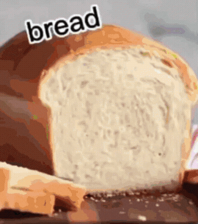 A Loaf Of Bread With The Word Bread Written On Top GIF