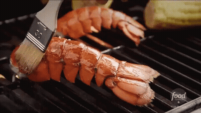 A Lobster Is Being Cooked On A Grill With A Brush And The Word Food Is On The Bottom GIF