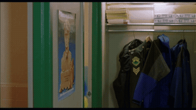 A Locker With A Poster On The Door That Says ' Military ' On It GIF