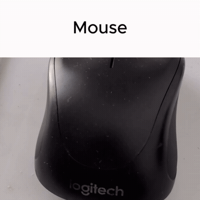 A Logitech Mouse Sits On A White Table GIF