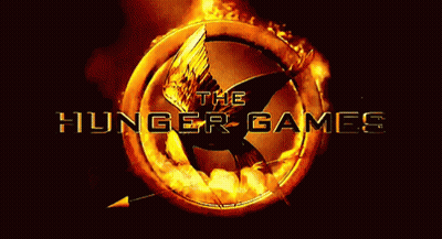 A Logo For The Hunger Games With A Flaming Bird In The Center GIF