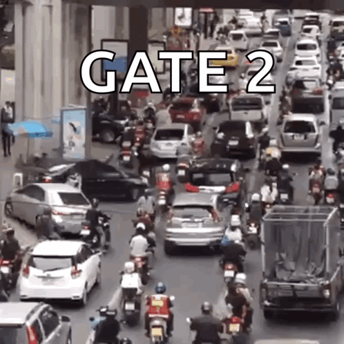 A Lot Of Cars And Motorcycles Are Driving Down A Street With The Words Gate 2 On The Bottom . GIF
