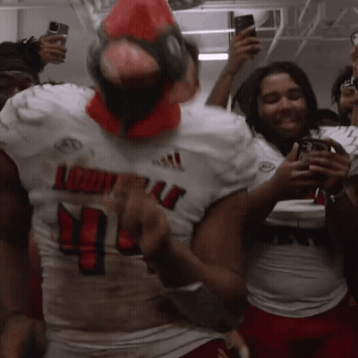 A Louisville Football Player Wearing A Red Cardinal Mask GIF