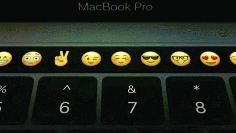 A Macbook Pro Keyboard With Smiley Faces And Numbers GIF