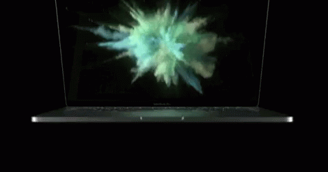 A Macbook Pro Laptop With Smoke Coming Out Of It GIF