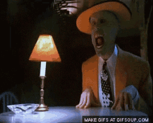A Make Gifs At Gifsoup.com Screenshot Of A Man In A Suit And Hat GIF