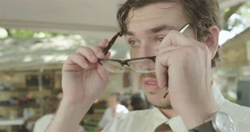 A Man Adjusts His Glasses While Wearing A Wrist Watch GIF