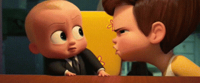 A Man And A Baby Are Standing Next To Each Other On A Table . The Baby Is Wearing A Suit And Tie . GIF