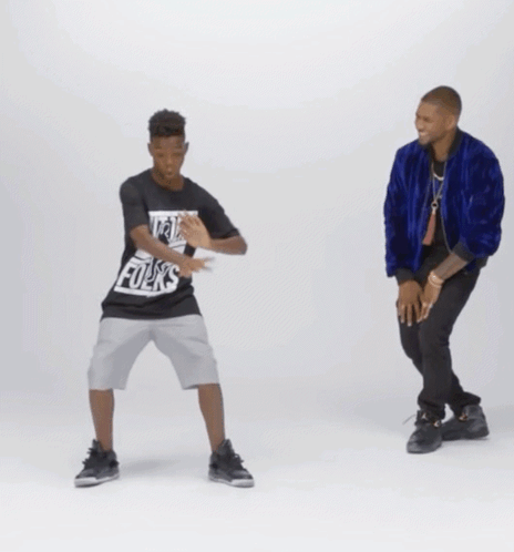A Man And A Boy Are Dancing And The Boy Is Wearing A Shirt That Says Hip Hop GIF