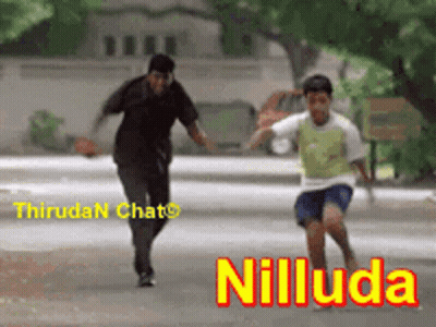 A Man And A Boy Are Running Down A Street With The Word Niluda On The Bottom Right GIF