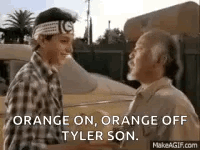 A Man And A Boy Are Shaking Hands In Front Of A Car And A Building . GIF