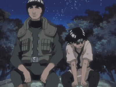 A Man And A Boy Are Sitting Next To Each Other And The Boy Has A Bandana On His Head GIF