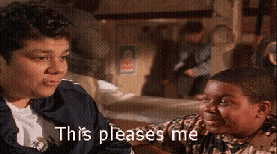 A Man And A Boy Are Sitting Next To Each Other In A Room And The Boy Is Saying This Pleases Me . GIF