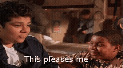 A Man And A Boy Are Sitting Next To Each Other In A Room And The Boy Is Saying This Pleases Me . GIF