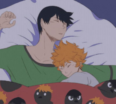A Man And A Child Are Sleeping In A Bed With Birds On The Blanket GIF