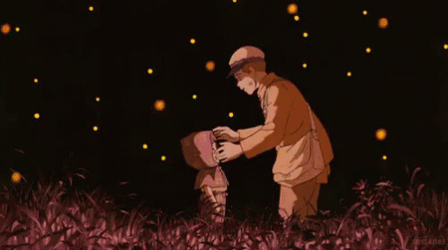 A Man And A Child Are Standing In A Field With Fireflies Flying Around Them GIF