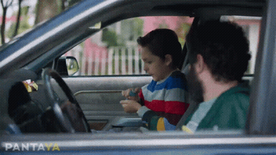 A Man And A Child In A Car With Pantaya Written On The Bottom Left GIF
