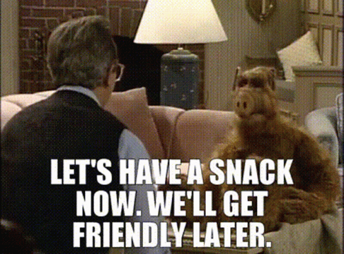 A Man And A Dog Are Sitting On A Couch With The Words Let 'S Have A Snack Now GIF