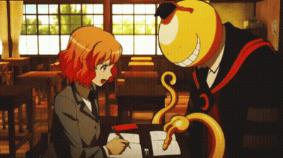 A Man And A Girl Are Sitting At A Desk In A Classroom And The Girl Is Writing In A Notebook GIF