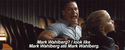 A Man And A Girl Are Sitting In A Movie Theater And The Girl Is Asking The Man If He Looks Like Mark Wahlberg . GIF