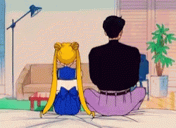 A Man And A Girl Are Sitting On The Floor In A Living Room . GIF
