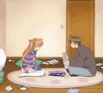 A Man And A Girl Are Sitting On The Floor In A Room Playing A Game . GIF