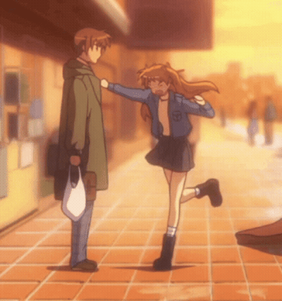 A Man And A Girl Are Standing On A Sidewalk And The Girl Is Wearing A Blue Jacket With The Letter S On It GIF