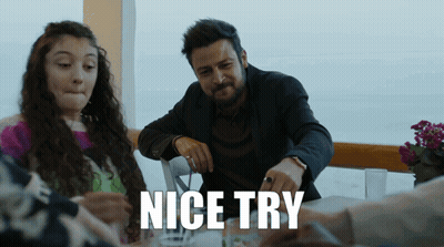 A Man And A Girl Sit At A Table With The Words Nice Try Written Below Them GIF