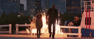 A Man And A Little Girl Are Walking In Front Of A Boat On Fire GIF