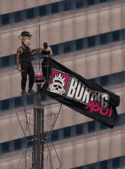 A Man And A Monkey Holding A Burning Merch Flag On Top Of A Building GIF