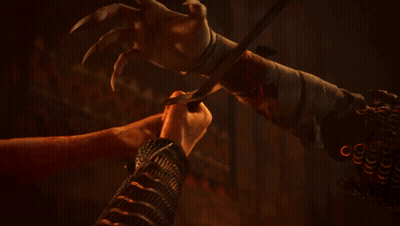 A Man And A Monster Are Looking At Each Other In The Dark GIF