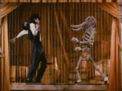 A Man And A Skeleton Are In A Cage And The Skeleton Is Wearing An Elephant Costume GIF