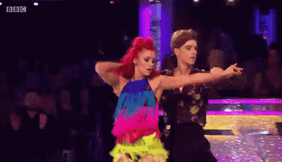 a man and a woman are dancing a dance on a stage .