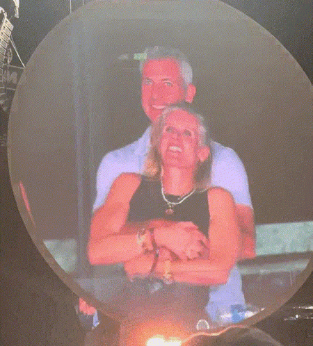A Man And A Woman Are Dancing In A Club GIF