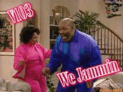 a man and a woman are dancing in a living room with a sign that says we jammin ..