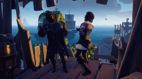 A Man And A Woman Are Dancing In Front Of A Large Body Of Water GIF