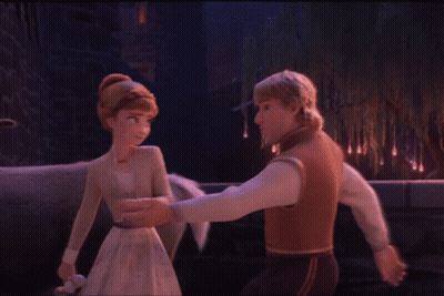 A Man And A Woman Are Dancing In Front Of A Tree GIF