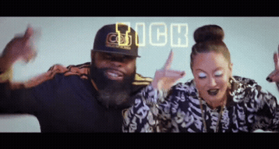 A Man And A Woman Are Dancing In Front Of The Word Rich GIF