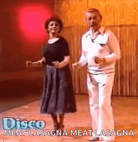 A Man And A Woman Are Dancing On A Dance Floor With The Words Disco Meat Lasagna Meat Lasagna Above Them GIF