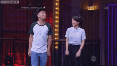 A Man And A Woman Are Dancing On A Stage With The Website Www.honeycam.tv Visible GIF