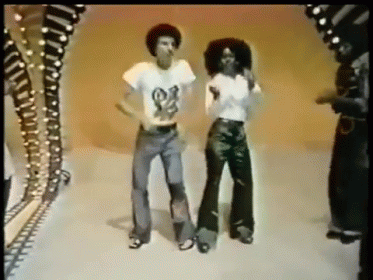 A Man And A Woman Are Dancing Together And The Man Has A Shirt That Says ' Snoop Dogg ' On It GIF