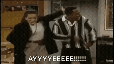A Man And A Woman Are Dancing Together In A Living Room In A Room . GIF