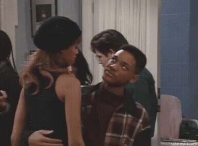 A Man And A Woman Are Dancing Together In A Room . GIF