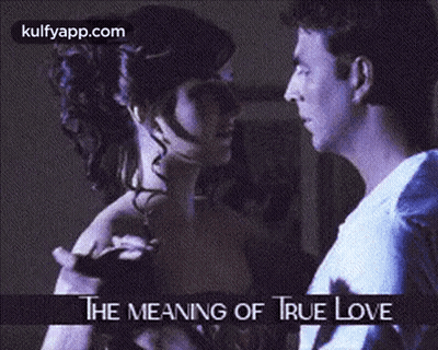 A Man And A Woman Are Dancing With The Words The Meaning Of True Love Below Them GIF