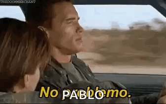 A Man And A Woman Are Driving A Car And The Man Is Saying `` No Pablo Mo '' . GIF