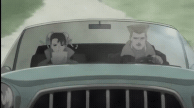 A Man And A Woman Are Driving A Car On A Road GIF